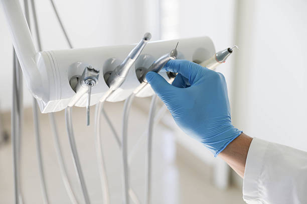 Professional Tooth Extraction technician working in East Camden, AR